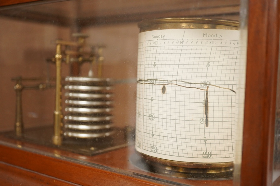 An early 20th century teak cased barograph by Ross, London No.A.529. with drawer underneath containing the original leaflet, spare papers, etc. Condition - fair to good.